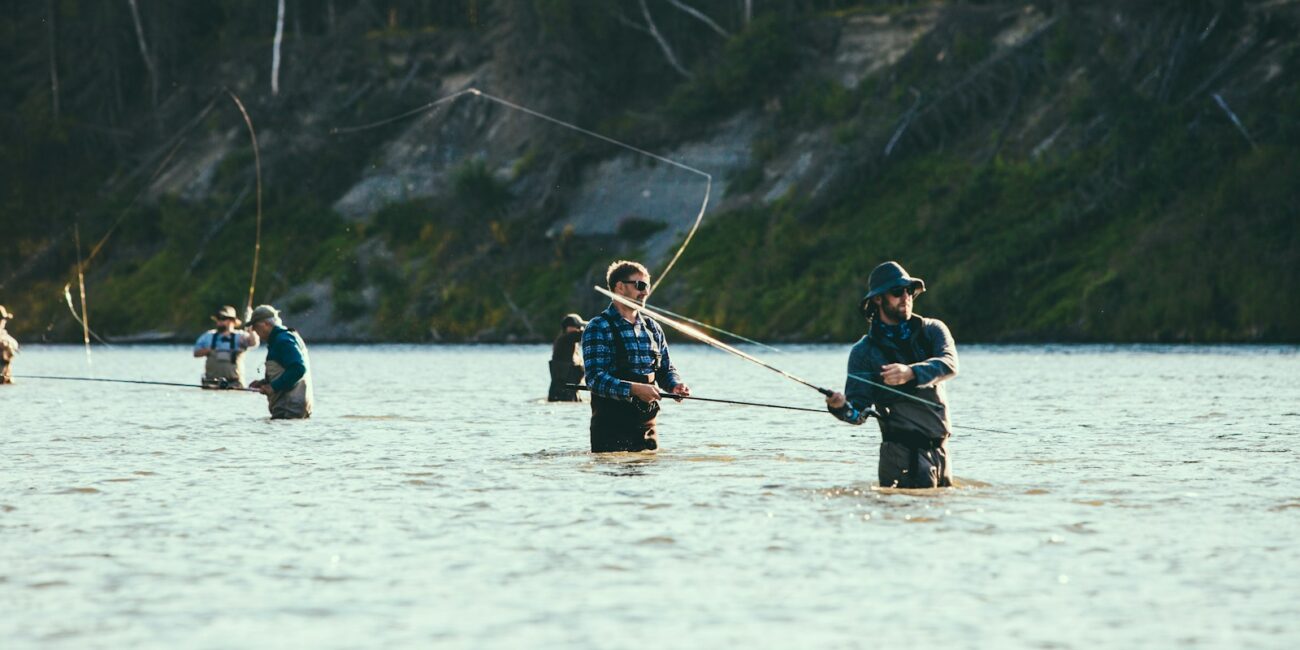 people riding on boat on lake during daytime